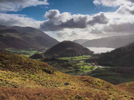View from High Rigg looking over the lake of Thirlmere and St Johns in the Vale under a blue and cloudy sky, Lake District, UK