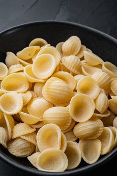 Durum wheat semolina pasta, on black background