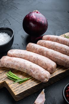 Traditional mest sausages, on black background.