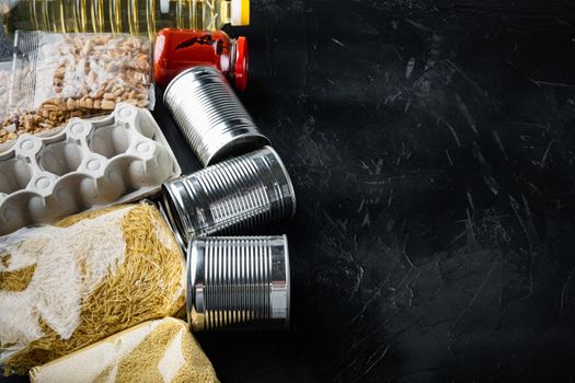Food set for home delivery, donation with space for text, on black background