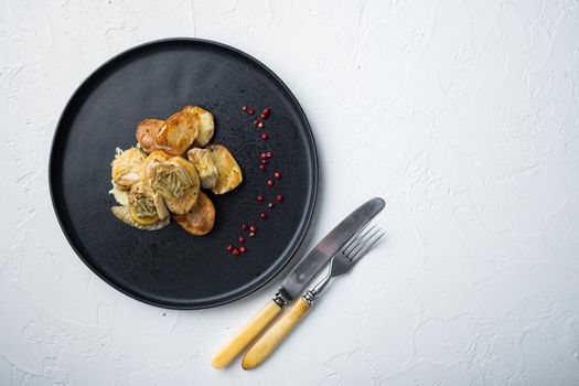Baked potato, artichoke with fennel al forno, on white textured background, flat lay with space for text