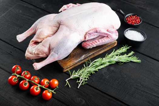 Recipe for cooking whole duck meat on black wooden background.