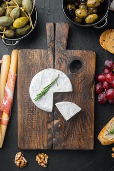Farm cheese camembert set, on black background, flat lay