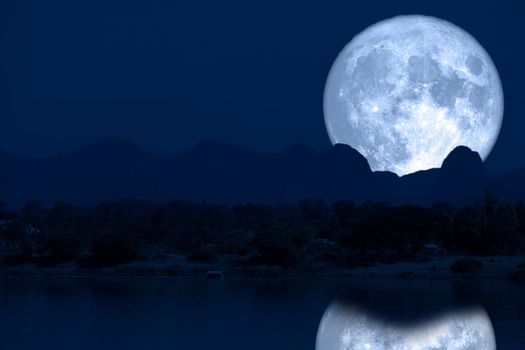 super full fish moon back reflection on river and mountain on night sky, Elements of this image furnished by NASA