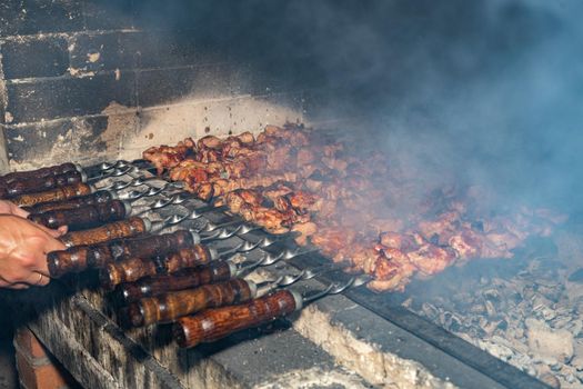 Frying kebabs. Cooking delicious barbecue. Ancient recipe for cooking.