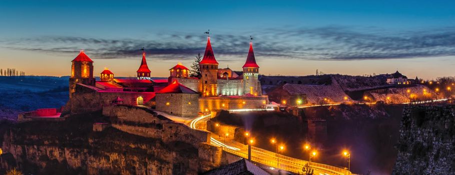 Kamianets-Podilskyi, Ukraine 01.07.2020. Panoramic view of the Kamianets-Podilskyi fortress on a winter night