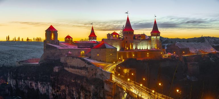 Kamianets-Podilskyi, Ukraine 01.07.2020. Panoramic view of the Kamianets-Podilskyi fortress on a winter night