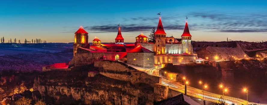 Kamianets-Podilskyi, Ukraine 01.07.2020. Panoramic view of the Kamianets-Podilskyi fortress on a winter night