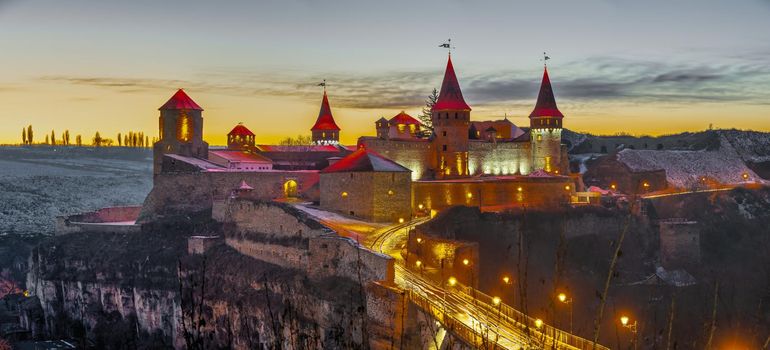 Kamianets-Podilskyi, Ukraine 01.07.2020. Panoramic view of the Kamianets-Podilskyi fortress on a winter night