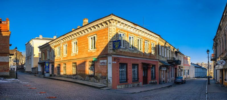 Kamianets-Podilskyi, Ukraine 01.07.2020. Historical Buildings on the old street of Kamianets-Podilskyi old town quarter on a sunny winter morning