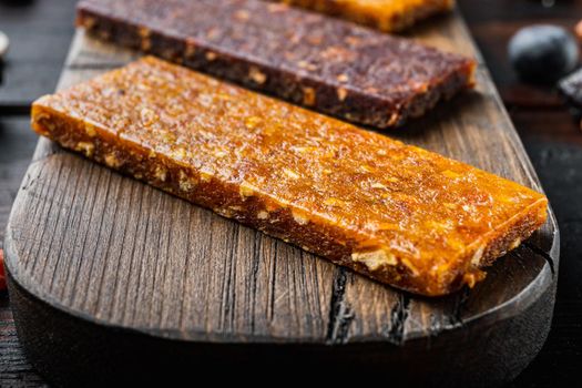 Fruit berry nut energy bars, healthy snack, on wooden table