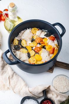 White tilapia fish, with basmati rice and cherry tomatoes, on white background