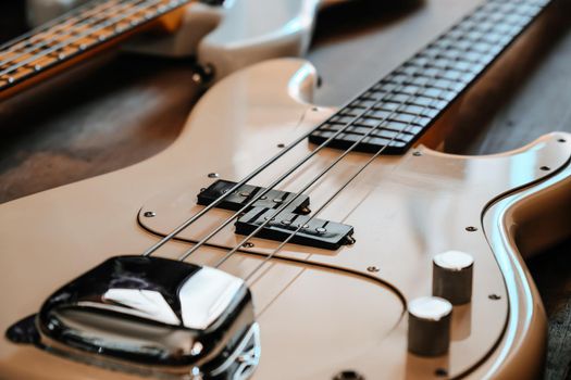 image of white Electric bass guitar closeup