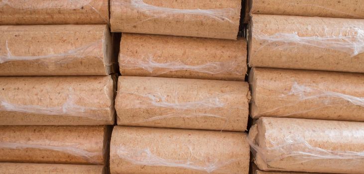 Wood briquettes for heating, packed in plastic film