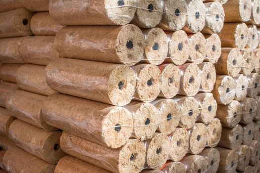 Wood briquettes for heating, packed in plastic film