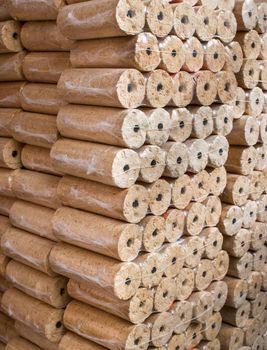 Wood briquettes for heating, packed in plastic film