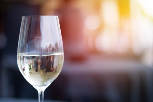 Cut out of a glass with white wine, summer time