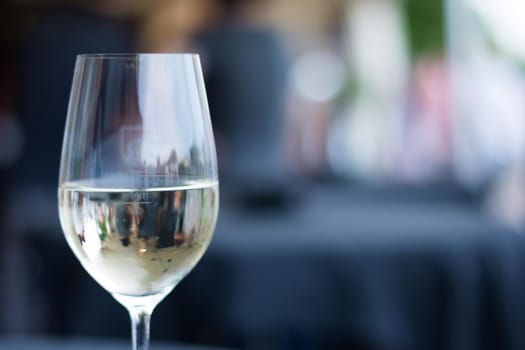 Cut out of a glass with white wine, summer time