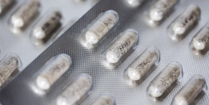 Pills / medicine lying on the table, flu season, close up