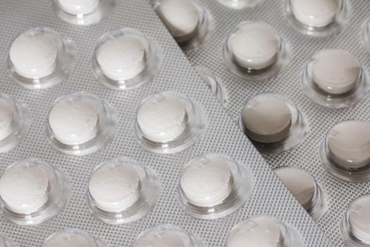 Pills / medicine lying on the table, flu season, close up