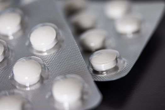 Pills / medicine lying on the table, flu season, close up