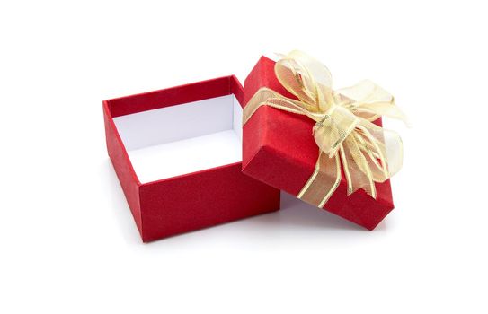 Red gift box and ribbon open isolated on white background, presents in valentine day or Christmas day, object in birthday or anniversary, package with wrap luxury, nobody, holiday and festive concept.