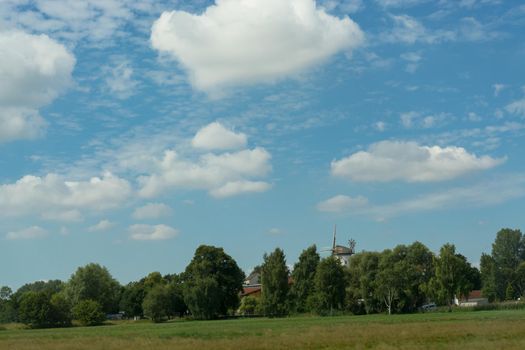 Countryside panorama blue sky Windmill in the background