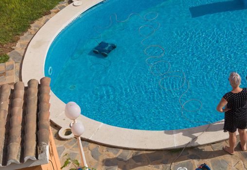 Automatic robot cleans the swimming pool underwater