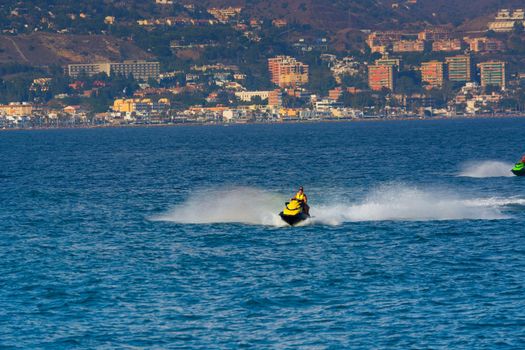 Young Man on Jet Ski, Tropical Ocean, Vacation Concept