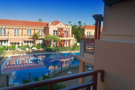 View of holiday apartment complex with swimming pool in Meloneras, Gran Canaria in Spain.