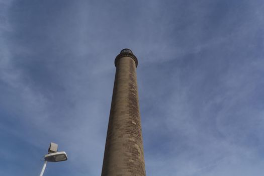 Faro de Maspalomas lighthouse on Gran Canaria in front of blue sky, Meloneras, Playa del Ingles.