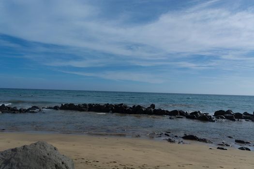 Beach of Gran Canaria in Meloneras, beach near lighthouse.