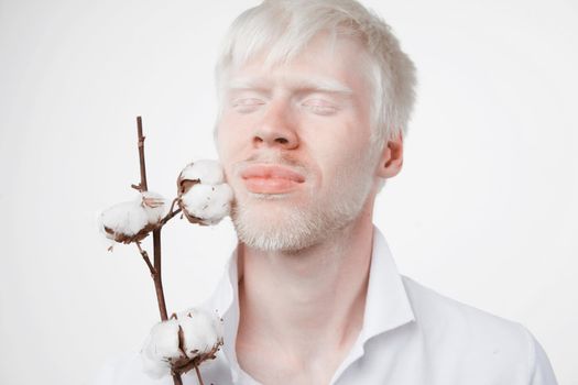 albinism Happy smile albino man white skin hair soft fluffy cotton brunch studio dressed t-shirt isolated white background abnormal deviations unusual appearance abnormality Beautiful people