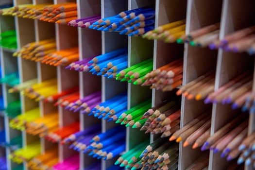 Showcase with colored pencils for drawing in the store for artists or stationery Art concept background