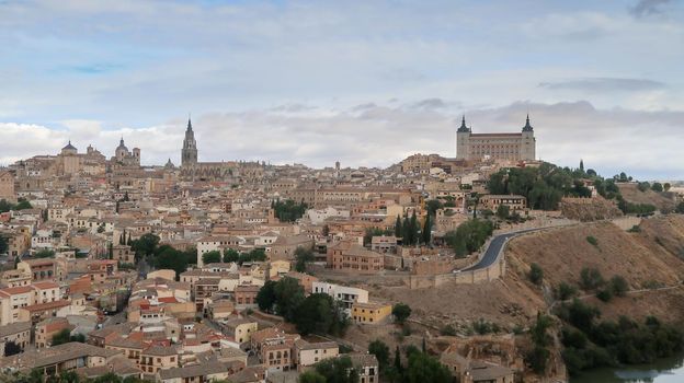 Mesmerizing shot of a beautiful cityscape and ancient castle of Toledo in Spain