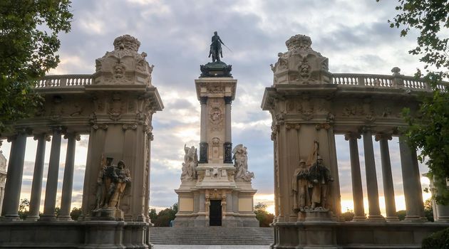 King Alfonso XII monument at El Retiro Park, Madrid during sunset. Iconic Park in the capital city of Spain.