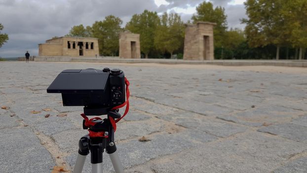 Camera taking timelapse of Temple of Debod during a cloudy day in Madrid, Spain