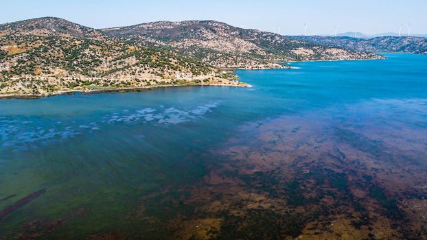 aerial drone shoot from side of an bafa lake at turkey. good looking blue dominant landscape and there is hills at background