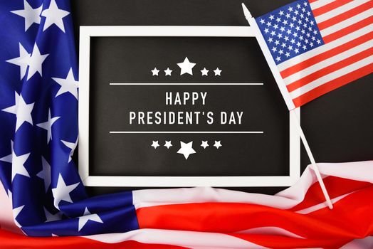 United States National Holidays. American or USA Flag with "HAPPY PRESIDENT'S DAY" text on black background, President Day concept