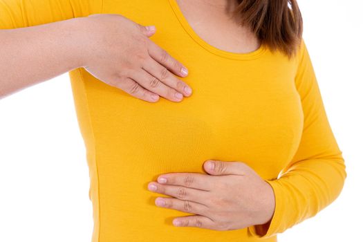 Woman hands doing breast self exam for checking lumps and signs of breast cancer isolated white background. Medical, healthcare for advertising concept.