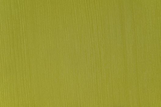 Rough textured surface imitation of mustard-colored wood close-up.Texture or background