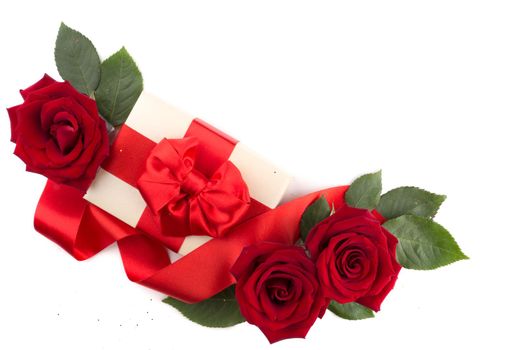 Valentine day gift box with red silk ribbon bow rose flowers isolated on white background love concept flat lay top view