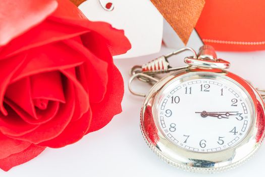 Close up pocket watch and red roses flower with copy space, Valentine'sDay concept