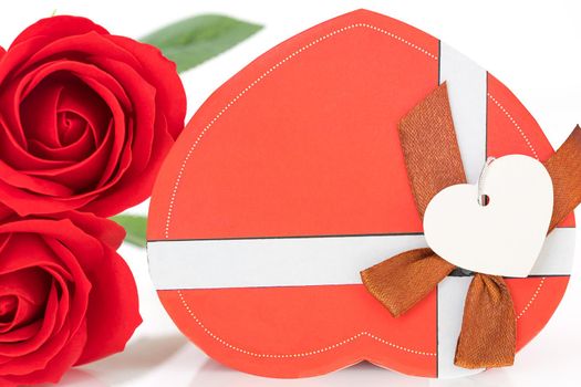Close up red rose and heart-shaped box ,Valentine's Day concept with roses and red heart-shaped box