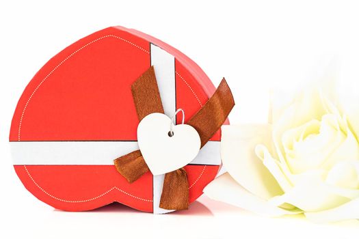 Close up red white and heart-shaped box ,Valentine's Day concept with roses and red heart-shaped box