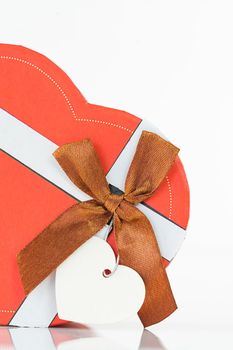 Close up red roses and heart-shaped box ,Valentine's Day concept with roses and red heart-shaped box