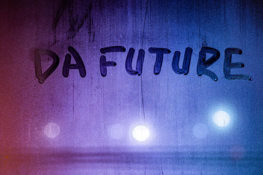 words da future handwritten on night foggy window glass surface, close-up with selective focus