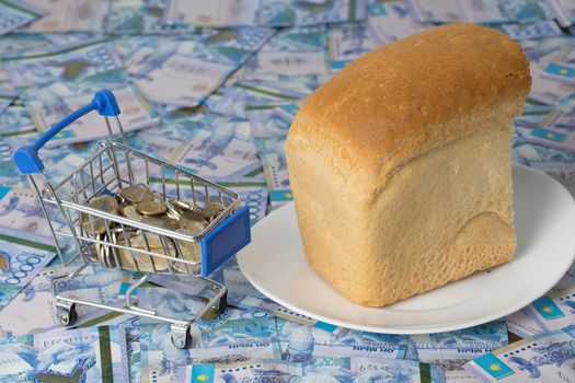 Kazakhstan tenge KZT in a grocery basket with bread. Rising food prices and groceries in Kazakhstan and other countries. Humanitarian assistance.