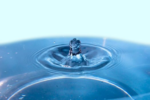 Abstract an outbreak of water. Splash of water close-up. Frozen water drop photographed at high speed.Slow dripping of liquid with air bubbles. Nature backgrounds or Wallpaper.Frozen liquid splashes