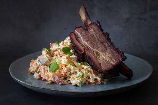 Texas style shortribs beef on plate with texan coleslaw